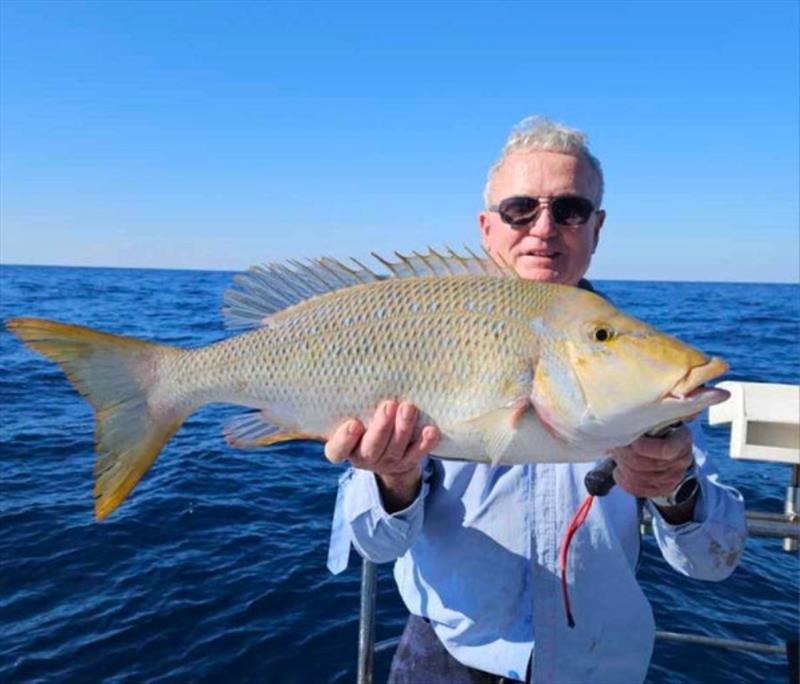 Wayne with a big Spango. They certainly pull better than they taste photo copyright Fisho's Tackle World taken at  and featuring the Fishing boat class