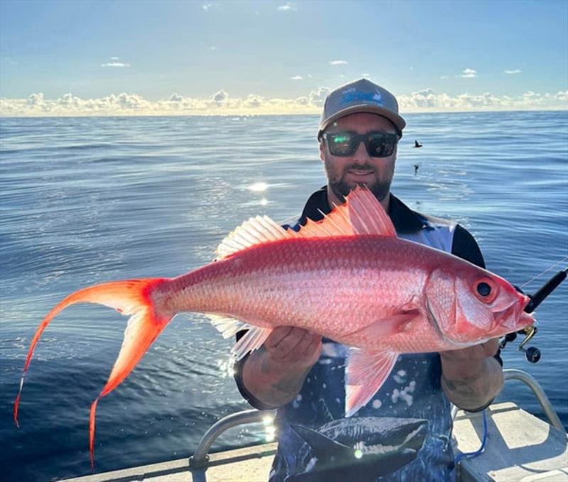 Glassed out seas whilst pulling flamies from the depths. It's a tough life eh Clayton - photo © Fisho's Tackle World