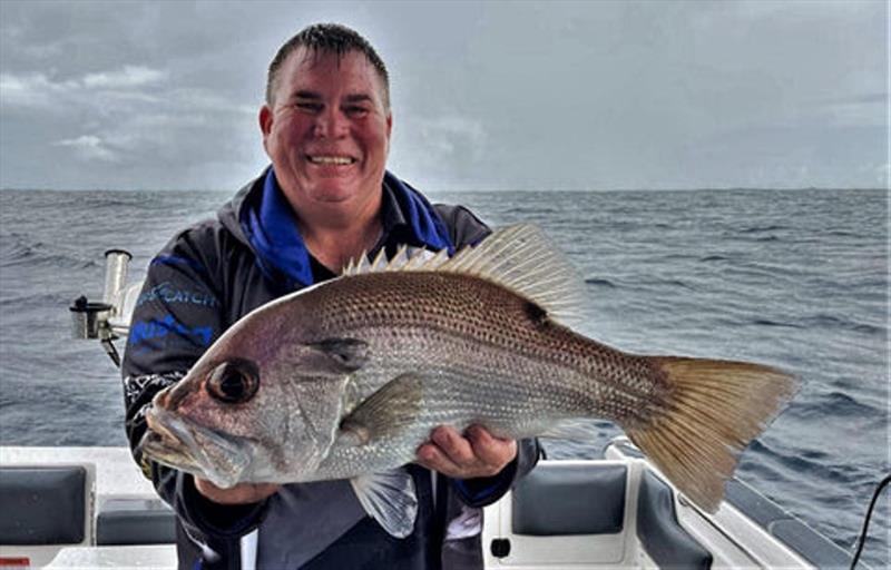 Kord Luckus from L Wilson & Co got amongst the reefies offshore during the Rainbow Beach comp. Here he is with a quality pearl perch - photo © Fisho's Tackle World