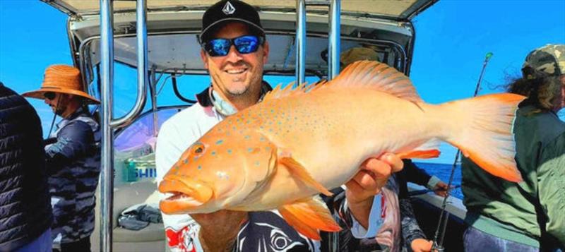 Hot Reels skipper, Pauly, with a nice bar cheek from the northern bay - photo © Fisho's Tackle World