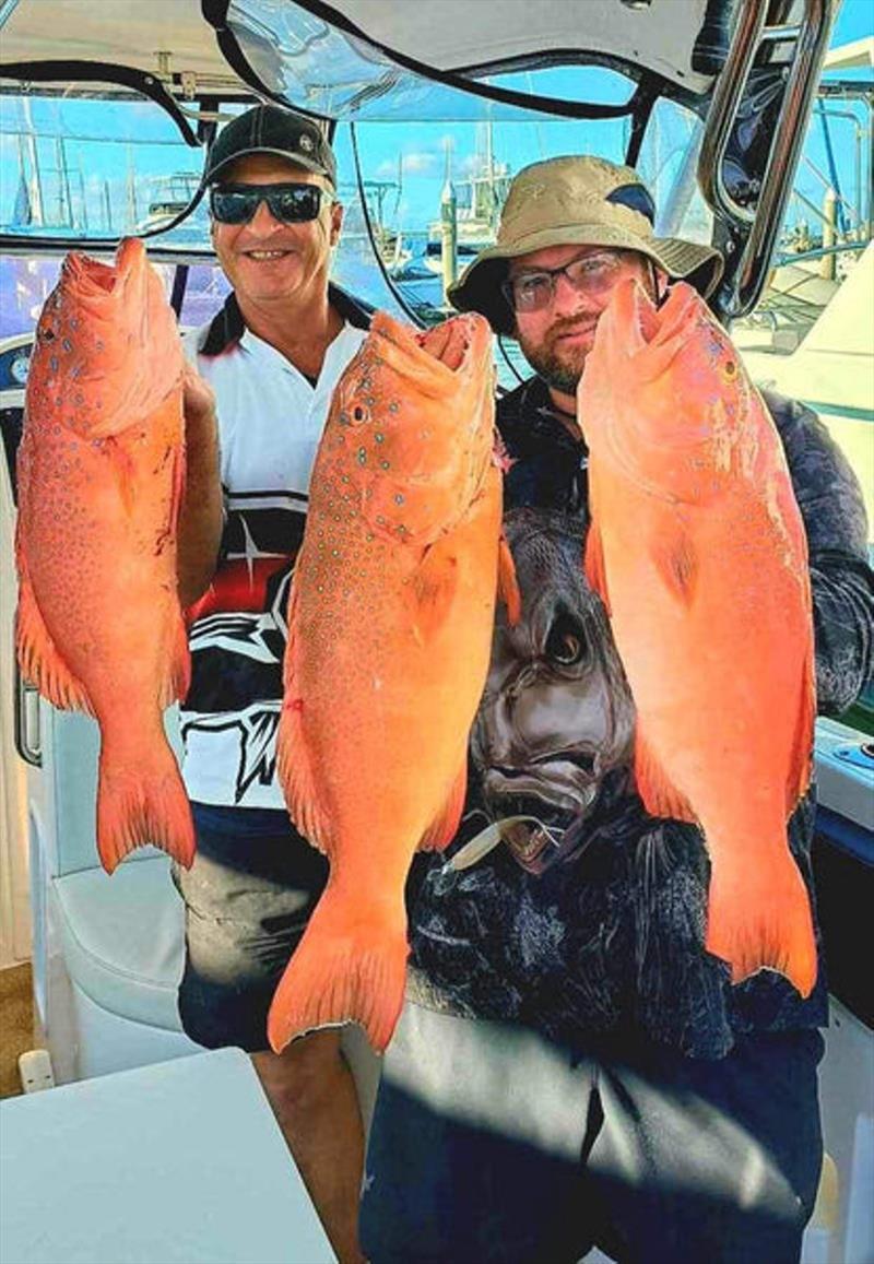 Hot Reels charter clients with a couple of recent coral trout captures - photo © Fisho's Tackle World