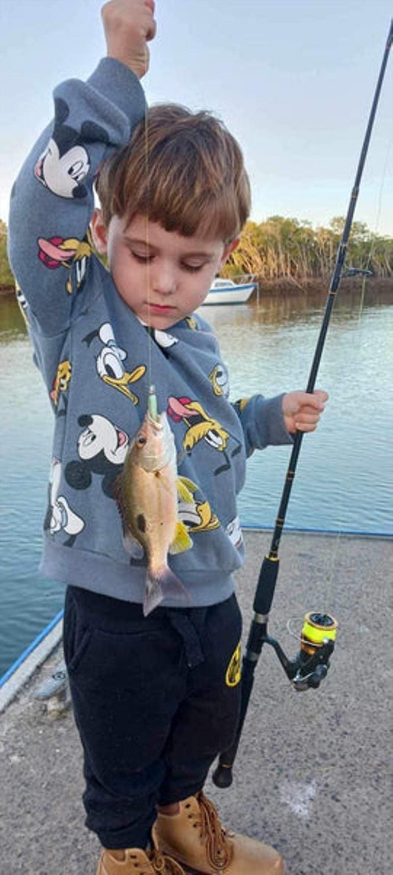 Kane's young bloke is proud of his Moses Perch on a plastic. Well done son - photo © Fisho's Tackle World