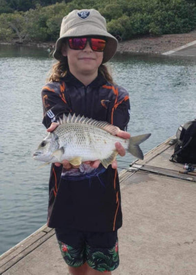Issaac is proud of this ripper bream from the River Heads pontoon. That's a beauty mate - photo © Fisho's Tackle World