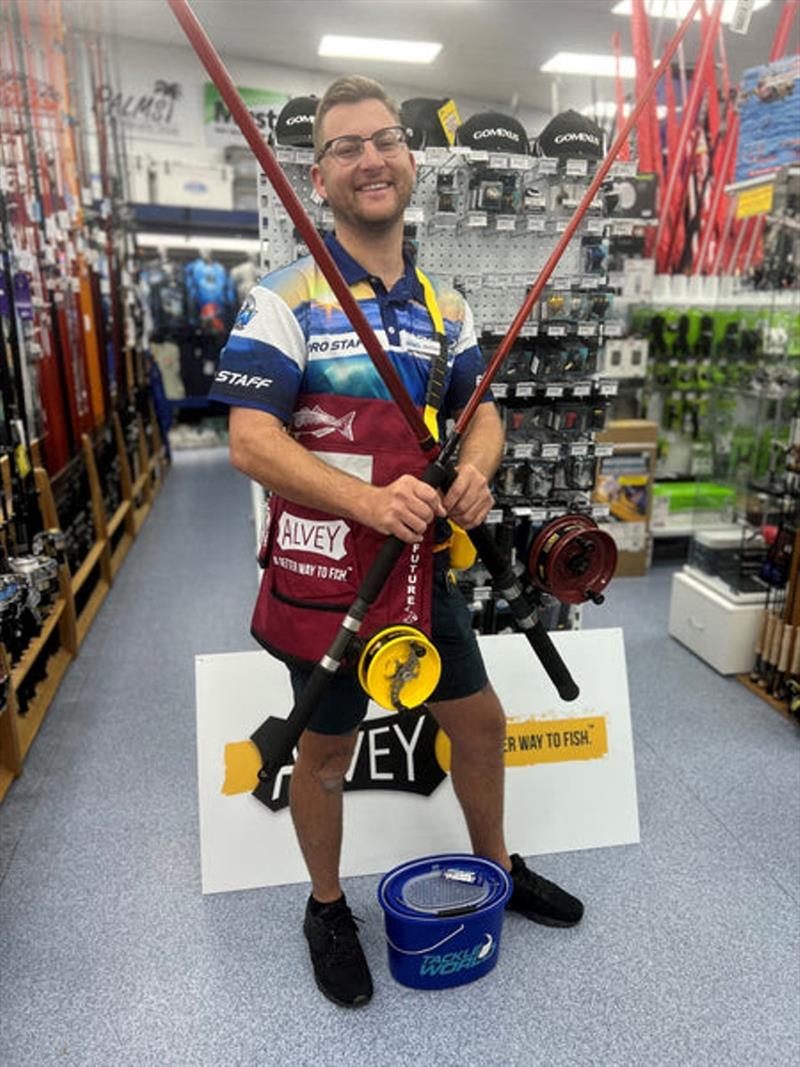 When city meets beach. Jacko hamming it up instore with a couple of new Alveys matched to some of Gary Howard's finest surf rods - photo © Fisho's Tackle World