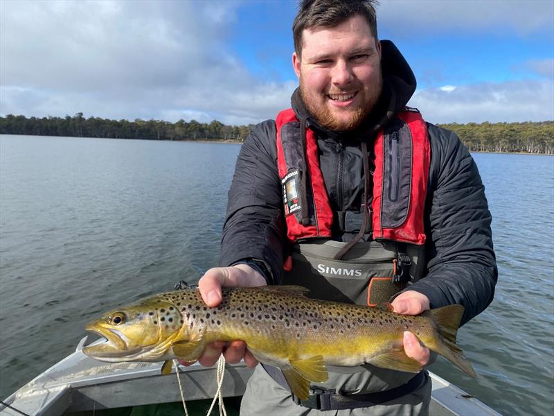 Angus  with a healthy Penstock Lagoon trout - photo © Spot On Fishing Hobart