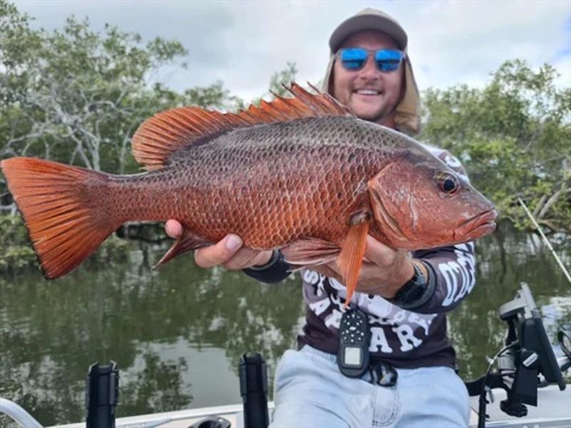 Jackson Ford with a red dog - photo © Fisho's Tackle World