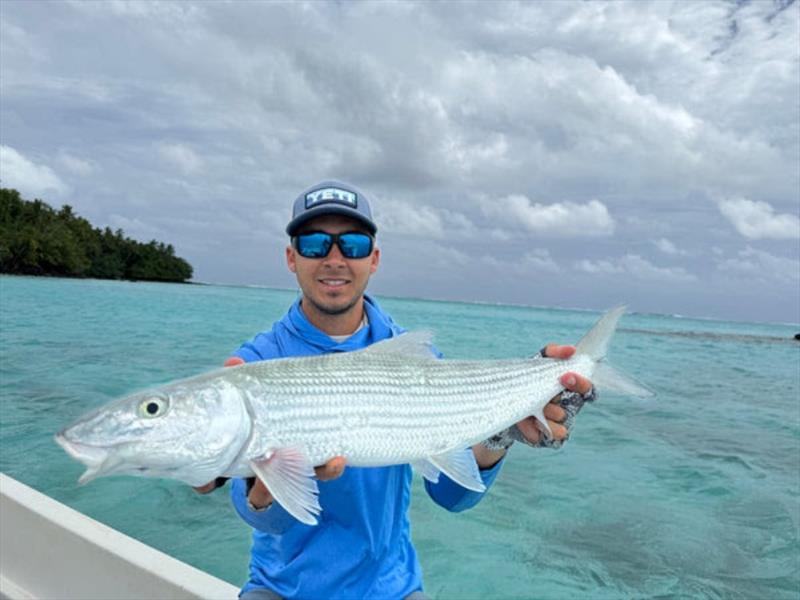 Dane managed a few bonefish on fly under cloudy skies at Aitutaki. Not too many fishos would be lucky enough to get away with this on their honeymoon - photo © Fisho's Tackle World