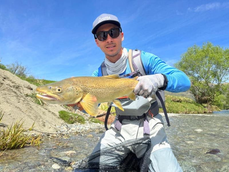 Dane pretending his NZ South Island brown trout was a metre plus Mondy barra. Nice fish in nice surrounds, but ...... - photo © Fisho's Tackle World