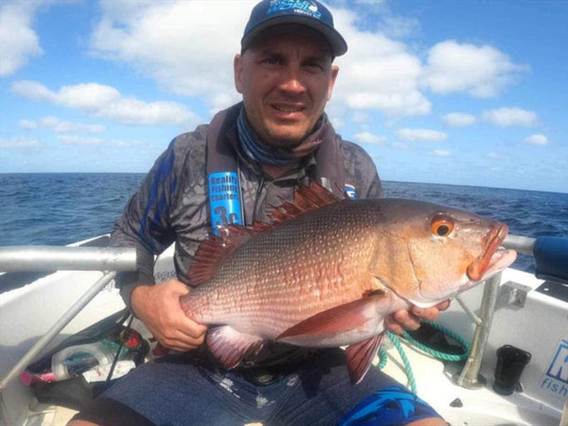 Red bass are a no take species, but terrific fun on lures around the shallow reefs and ledges of the Swains and beyond - as Jaymes found out - photo © Fisho's Tackle World