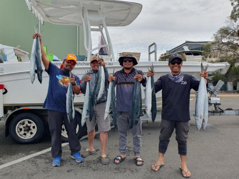 Happy clients with fists full of spotty mackerel from the northern bay. Jump aboard a Hot Reels Charter and this could be you - photo © Fisho's Tackle World