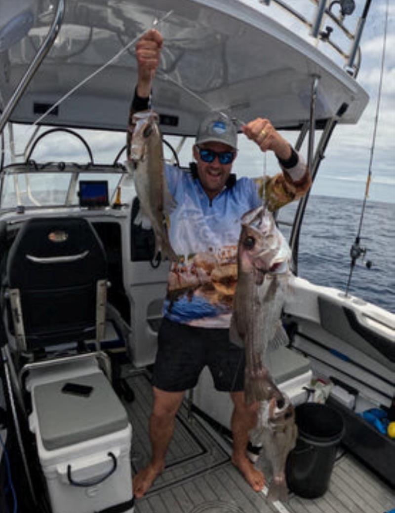 Kyle Leaver with a triple hook up of tasty pearl perch on the deep drop gear - photo © Fisho's Tackle World