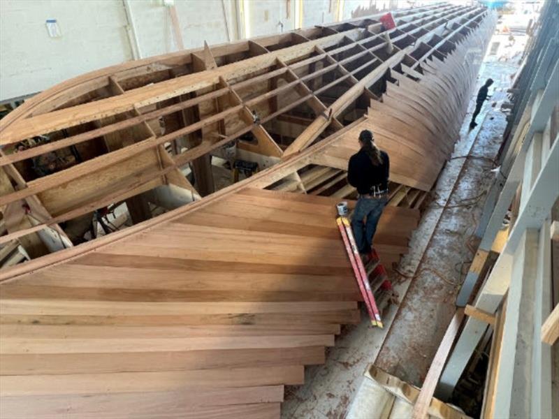 Hull #11 - Scott on starboard side first layer - photo © Michael Rybovich & Sons