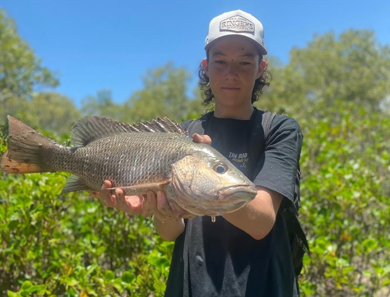 If you are willing to get your feet muddy like Max, then you can add mangrove jacks to your hit list whilst your wander our creeks - photo © Fisho's Tackle World