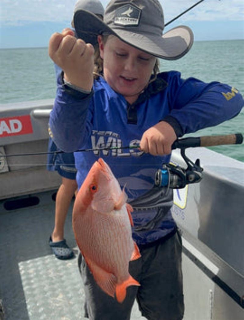 Olly Pearce with his first scarlet (nannygai). The rod work from this young lad on a noodle stick is as good as you will see photo copyright Fisho's Tackle World taken at  and featuring the Fishing boat class