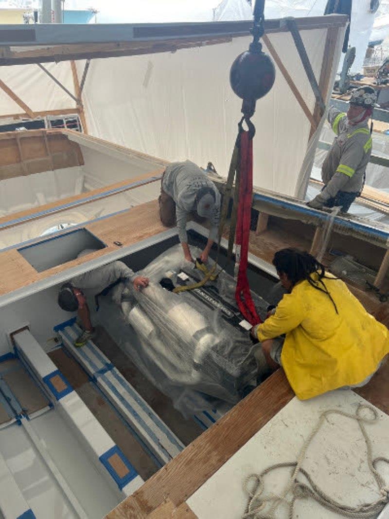 Hull #10 - Chris steadying port engine - photo © Michael Rybovich & Sons