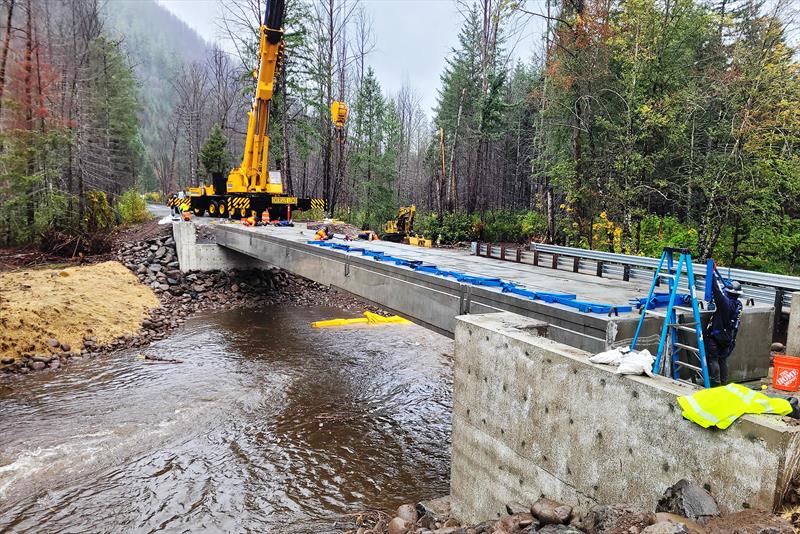 Work crews build the new bridge at Quartz Creek - photo © McKenzie Watershed Council