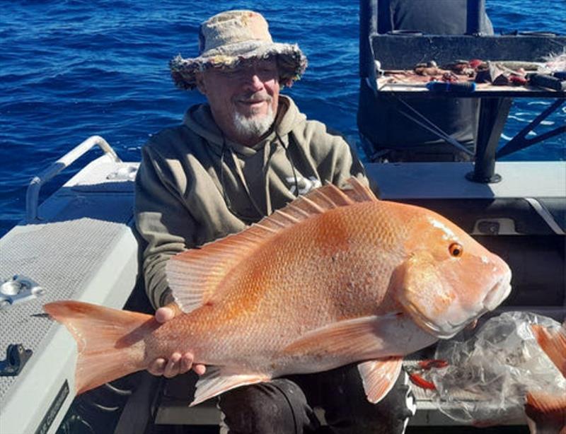 Darrel with a thumper red emperor from off Stanage Bay - photo © Fisho's Tackle World