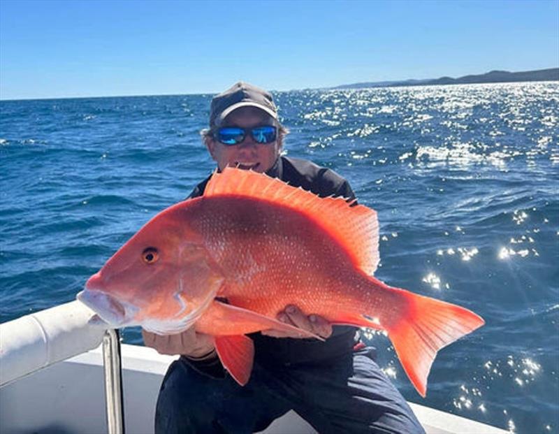 Chris with more of the right-coloured fish from his Stanage Bay trip - photo © Fisho's Tackle World