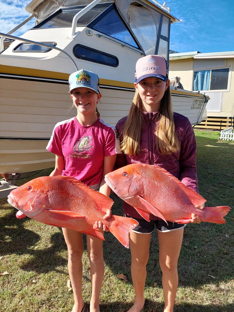 Megan and Amelia Jorgensen from out Wondai way headed wide with their dad, Neil, last week just before the westerly blow, and scored some ripper reds photo copyright Fisho's Tackle World Hervey Bay taken at  and featuring the Fishing boat class