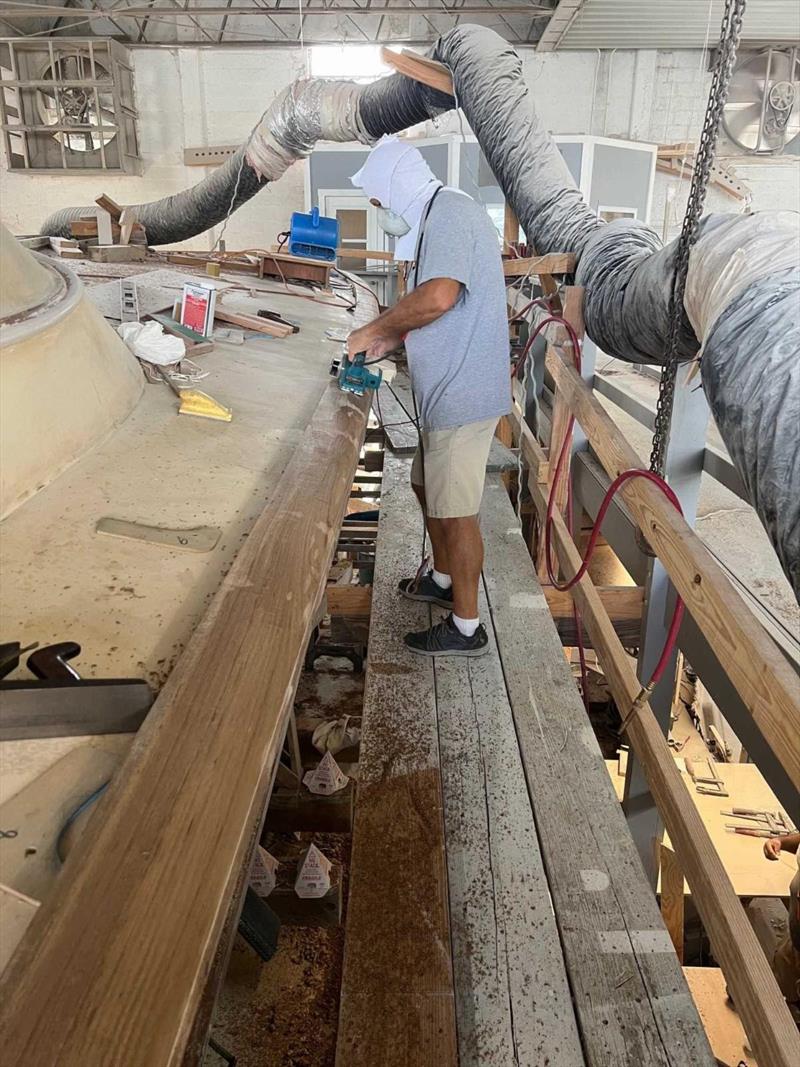 Hull #9 - Mike M shaping the toe rail photo copyright Michael Rybovich & Sons taken at  and featuring the Fishing boat class