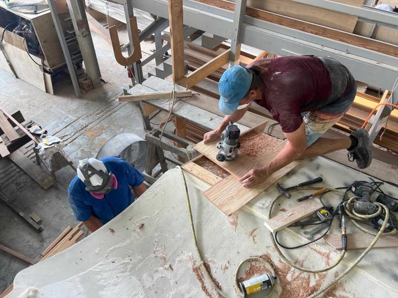 Hull #11 - Scott on the trim tab pockets - photo © Michael Rybovich & Sons