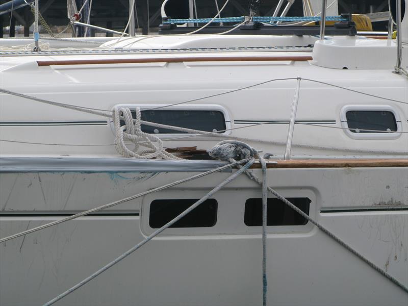 BoatUS hurricane preparation information for boat owners includes helpful diagrams on how to best protect a boat stored in the water, such as here when a slip is not available photo copyright BoatUS taken at  and featuring the Fishing boat class