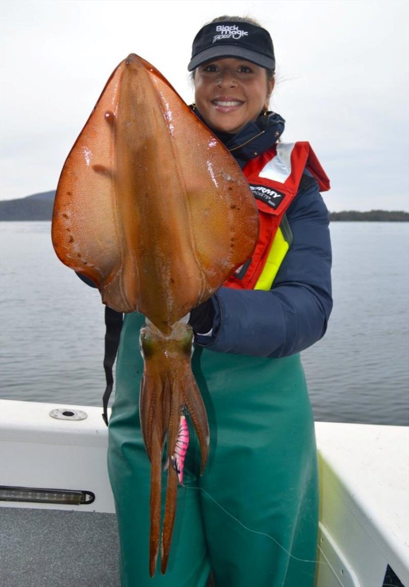 Devi Barker with a big 40cm+ hood calamari fishing on the Tasman Peninsula. Caught on a BMT Squid Snatcher 3.5 photo copyright Spot On Fishing Hobart taken at  and featuring the Fishing boat class