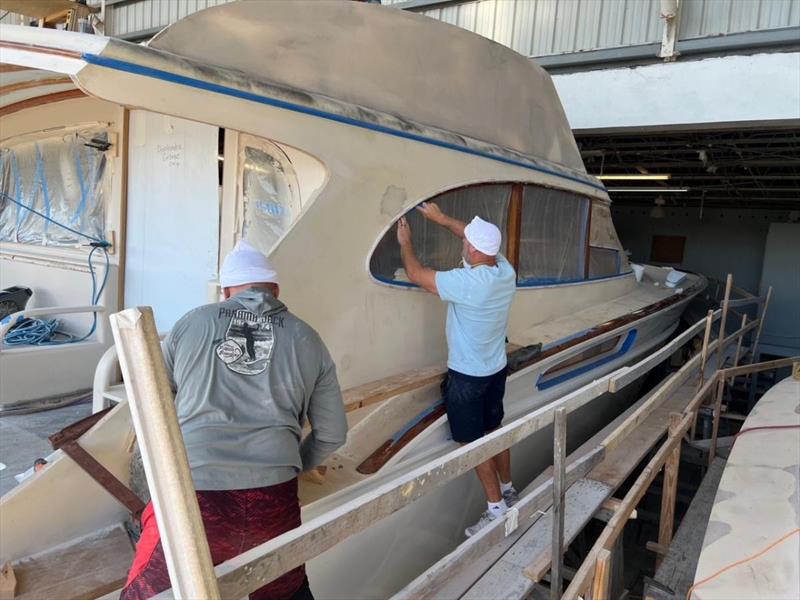 Hull #9 - Bernard prepping deckhouse for finish primer - photo © Michael Rybovich & Sons