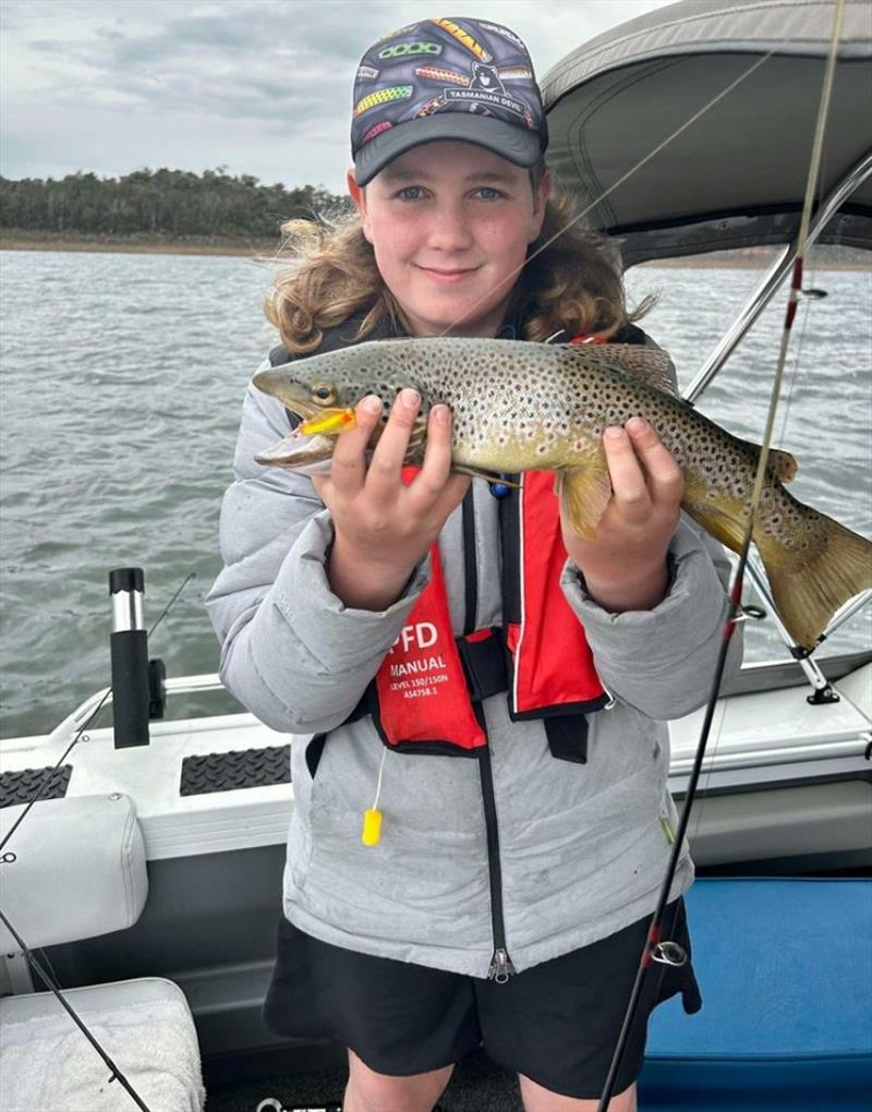 Charlie with another brown falling to the MOJO24 photo copyright Spot On Fishing Hobart taken at  and featuring the Fishing boat class