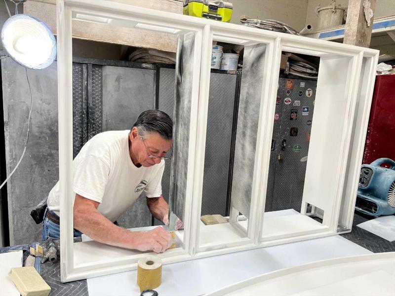 Hull #9 - Keith prepping aft engine room component boxes - photo © Michael Rybovich & Sons