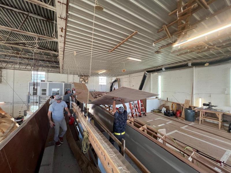 Hull #11 - Foredeck planking installation - photo © Michael Rybovich & Sons