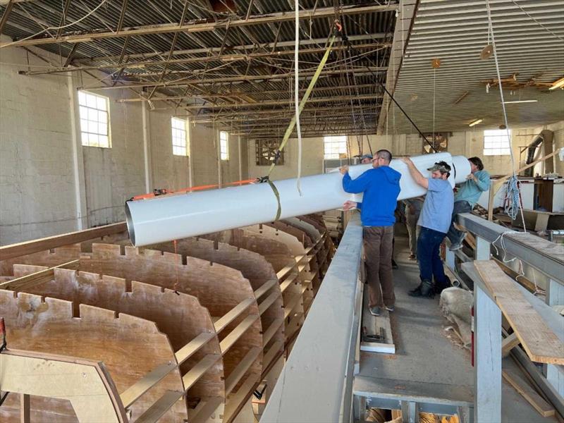 Hull #11 - Swinging muffler into place - photo © Michael Rybovich & Sons