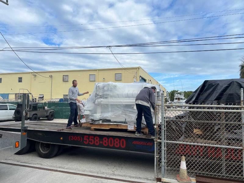 Hull #11 - Dusty, Brett and Bill prepping engines for lift - photo © Michael Rybovich & Sons