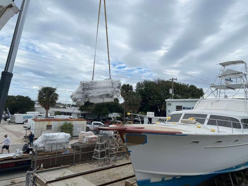 Hull #11 - Swinging the engines across the yard - photo © Michael Rybovich & Sons