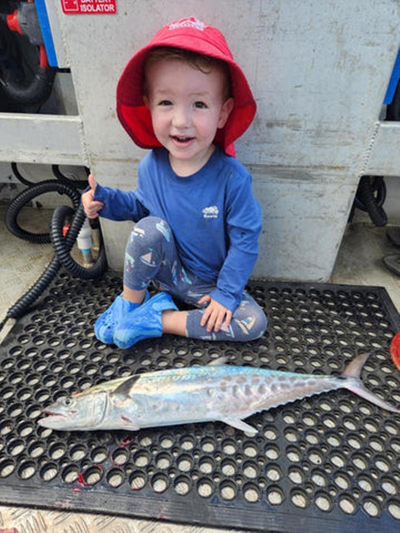 Commercial Chaos' junior deckie, Tomnado, following in dad's footsteps, catching his first ever schoolie - photo © Fisho's Tackle World