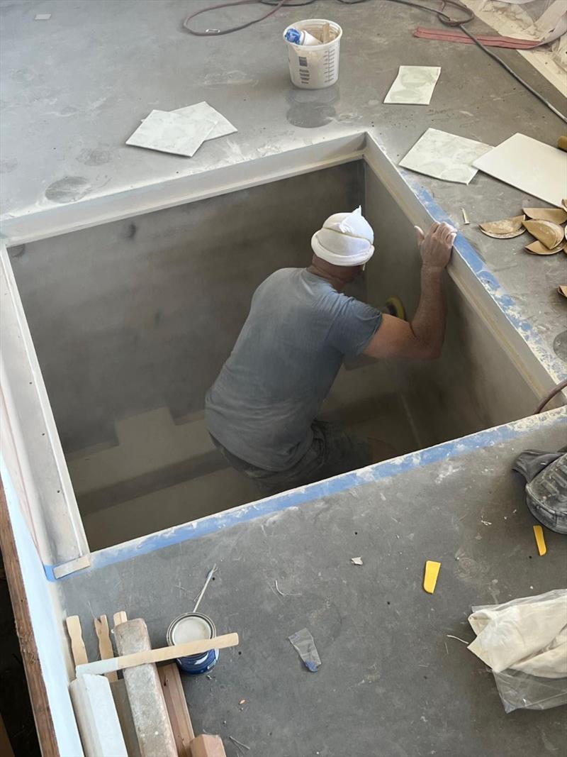 Hull #11 - Bernard prepping Seakeeper box - photo © Michael Rybovich & Sons