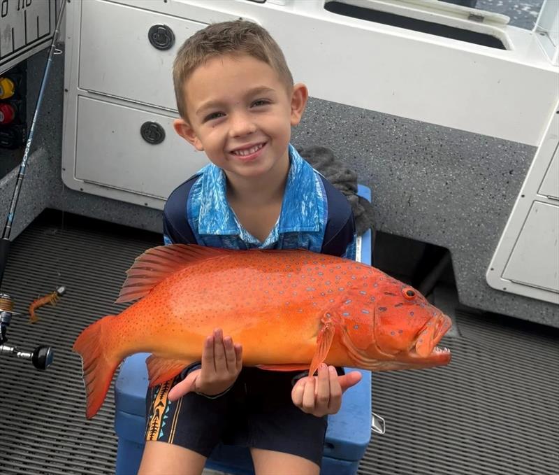 How happy would your kids be if you could put them onto solid coral trout like this one. Leo scored bigtime on his first trip to the GBR - photo © Fisho's Tackle World