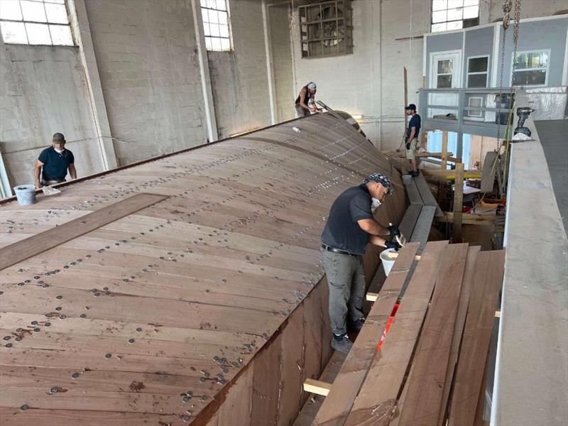 Hull #12 - Hull crew planking the bottom - photo © Michael Rybovich & Sons