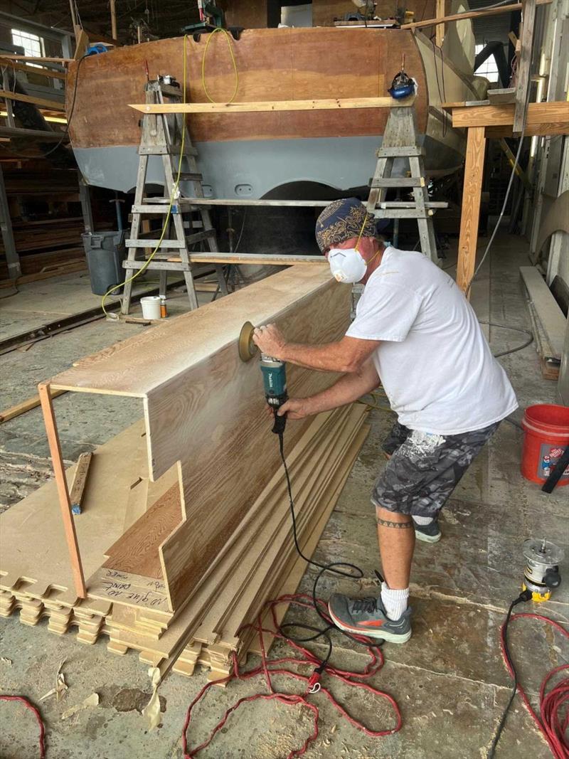 Hull #12 - Glenn assembling bulkheads - photo © Michael Rybovich & Sons