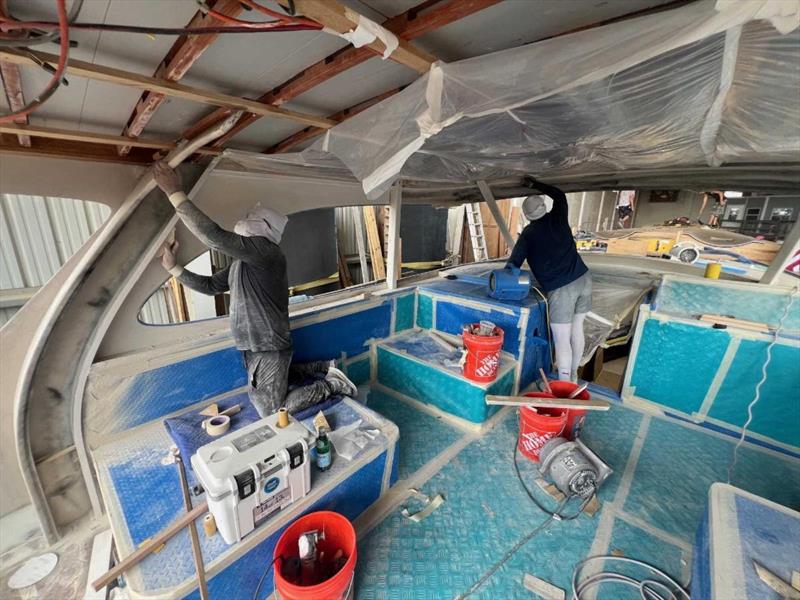 Hull #10 - Sanding primer - photo © Michael Rybovich & Sons