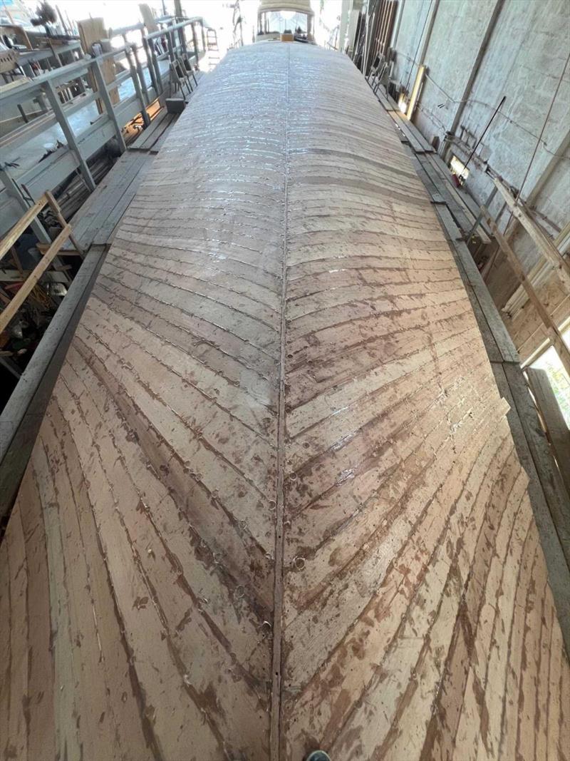 Hull #12 - Bottom planking complete - photo © Michael Rybovich & Sons