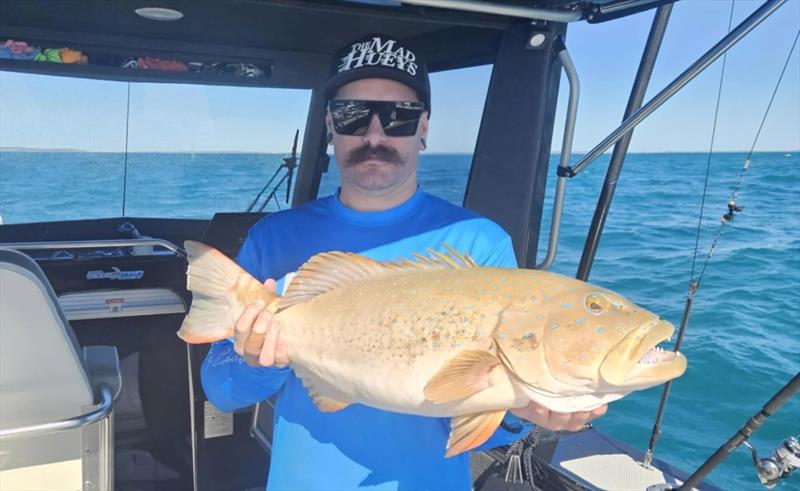 Mitch McCarthy with a very solid trout for inshore Hervey Bay waters - photo © Fisho's Tackle World Hervey Bay