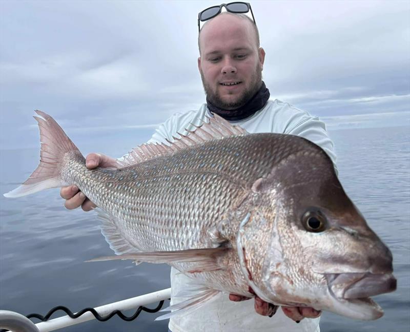 Nathan Dunn and an 80cm+ snapper. These big fish are here to breed and will be spawning during the upcoming month-long closure - photo © Fisho's Tackle World Hervey Bay