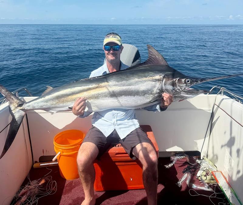 It took Pete an hour to land this solid little black north of Rooneys last Saturday. Over 30 jumps made for a true spectacle only billfish can offer - photo © Fisho's Tackle World Hervey Bay