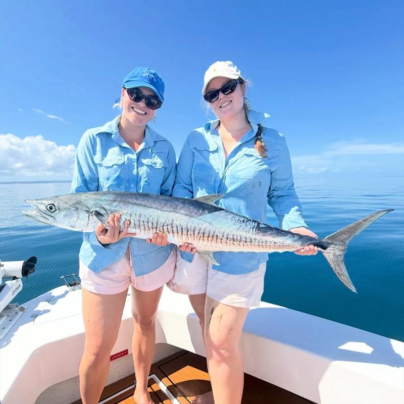 Happy girls cradling a nice spaniard caught aboard a Saltwater Playground Charter photo copyright Fisho's Tackle World Hervey Bay taken at  and featuring the Fishing boat class