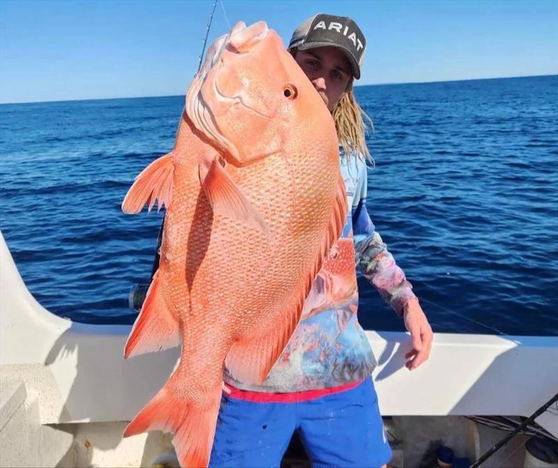 Ash Ross trying to keep up with his older brother Chris. The boys got into some ripper reds recently photo copyright Fisho's Tackle World Hervey Bay taken at  and featuring the Fishing boat class