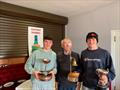 David Evans & William Draper (Sligo YC) receiving their prizes from Lough Erne Yacht Club Commodore Raymond Morrison after the GP14 Hot Toddy 2024 at Lough Erne © Peter Brines