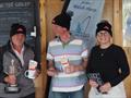 Commodore Liz Guest presents Maurice and Romek their prizes, modelling their P&B beanies during the GP14 Venetian Trophy at Welsh Harp © Luke Howard @WHSC