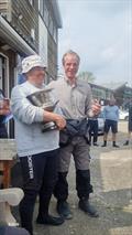 Maurice and Romek receive the 2024 Travellers Trophy during the GP14 Venetian Trophy at Welsh Harp © Joy Walter @WHSC