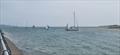The fleet returning during the 2025 Doyle Sails GP14 Championship of Ireland at Rush Sailing Club © Lauren O'Hare, Aisling Kelly & Andy Johnston
